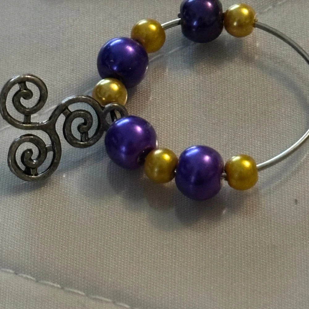 Wine glass tag stainless steel hoop gold/purple beads Celtic triple spiral